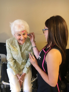 mode de vie fit shanna baby shower grandma getting her face painted with a flamingo